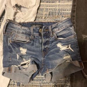 blue ripped jean shorts